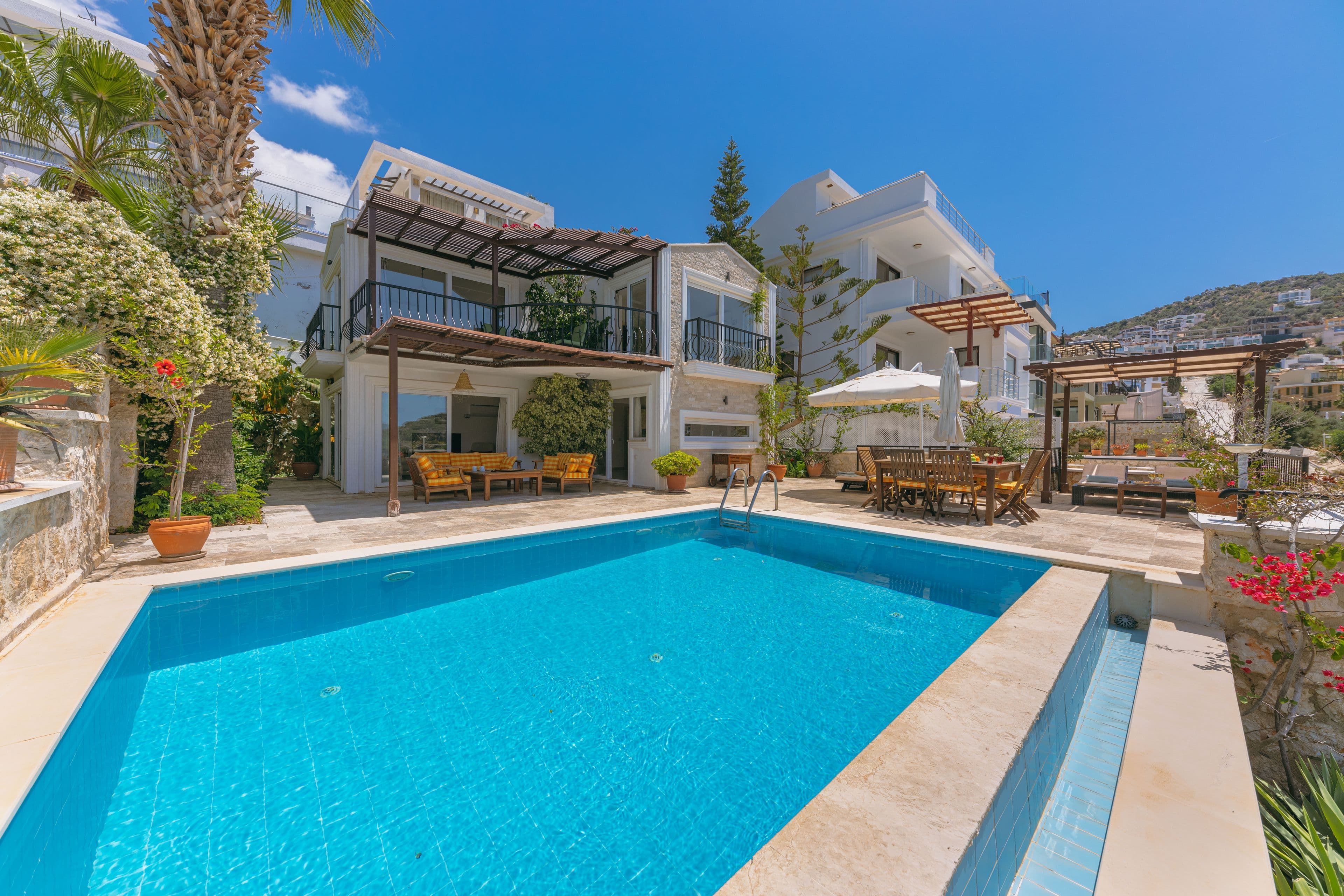 Private villa with a sunlit terrace and swimming pool