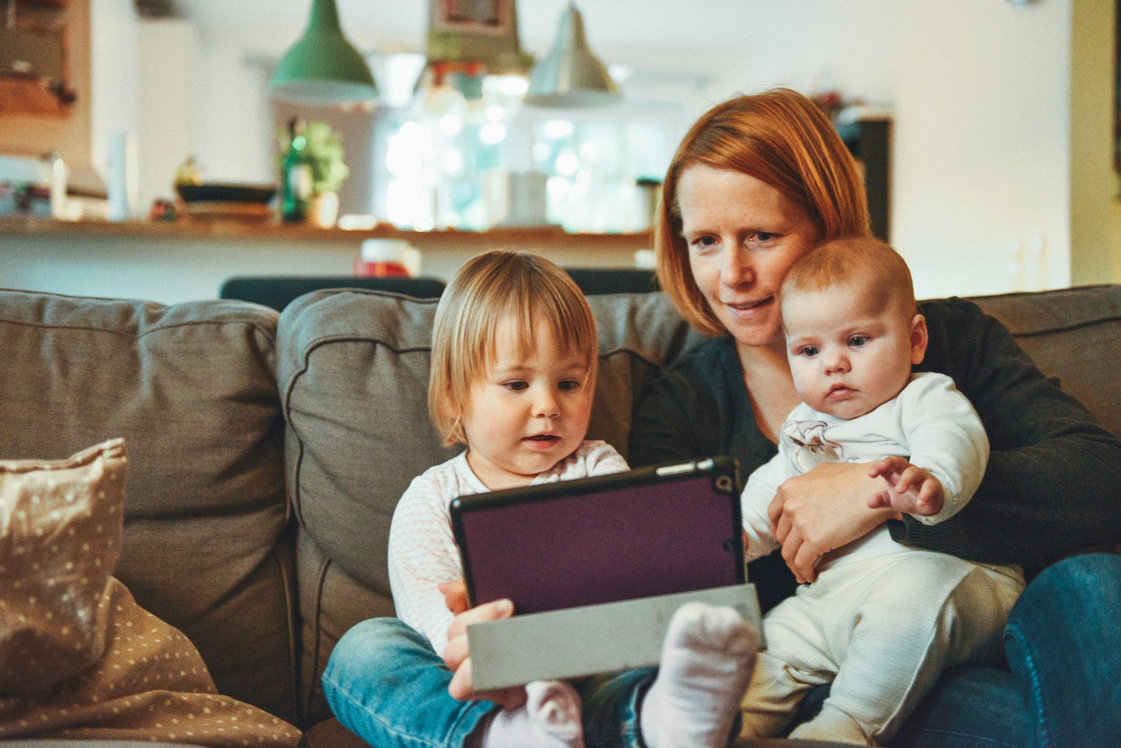 A woman spending time with two children