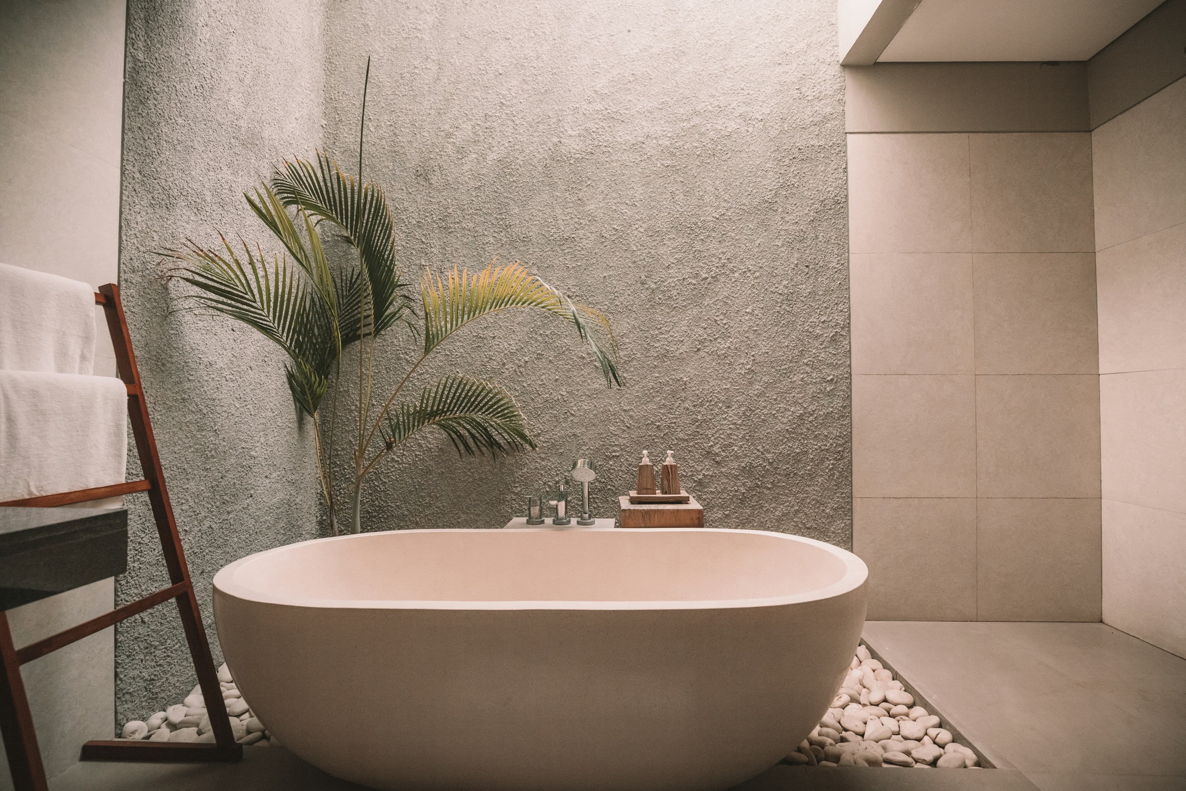 A freestanding bath in a stone interior