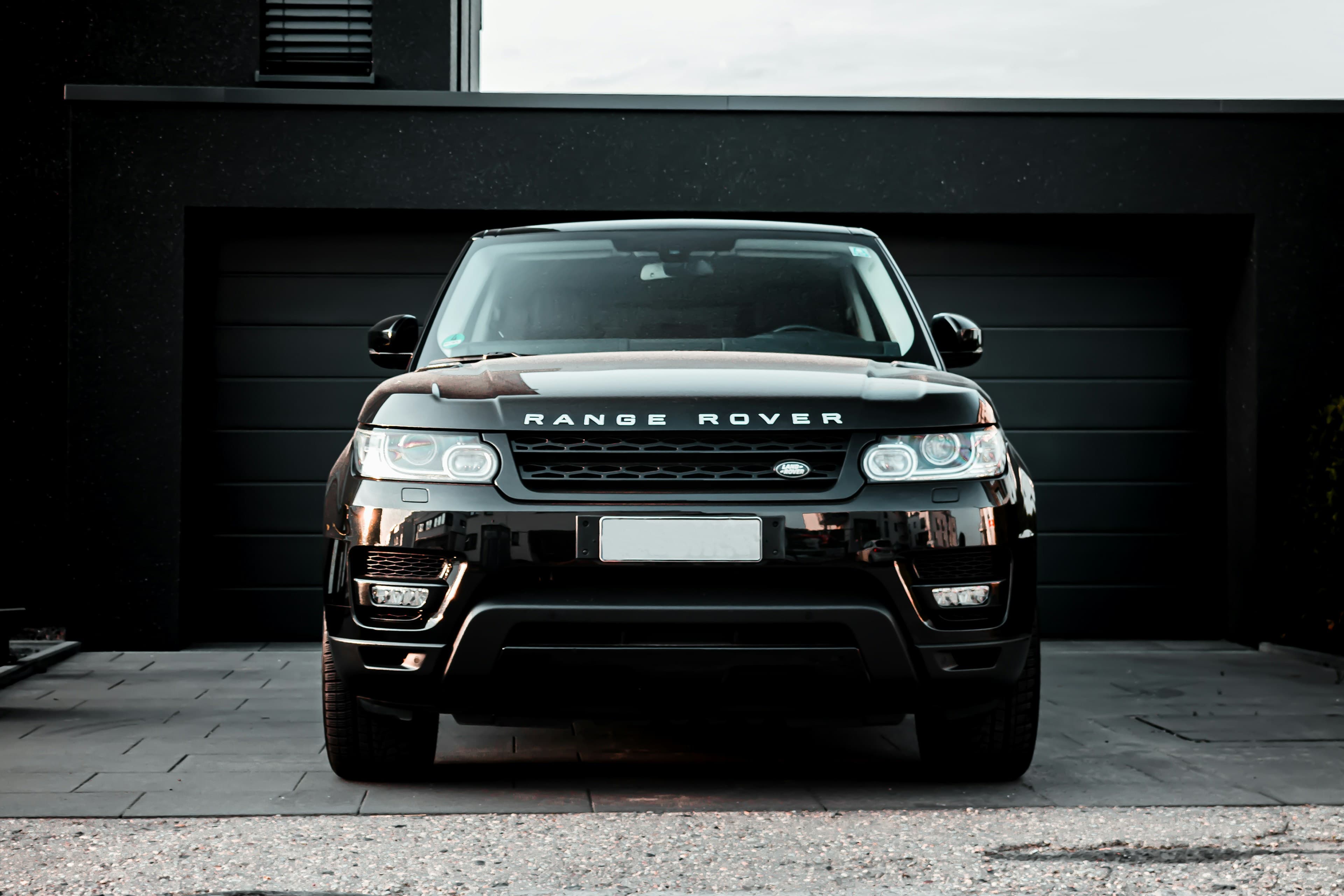 A black luxury SUV in a garage