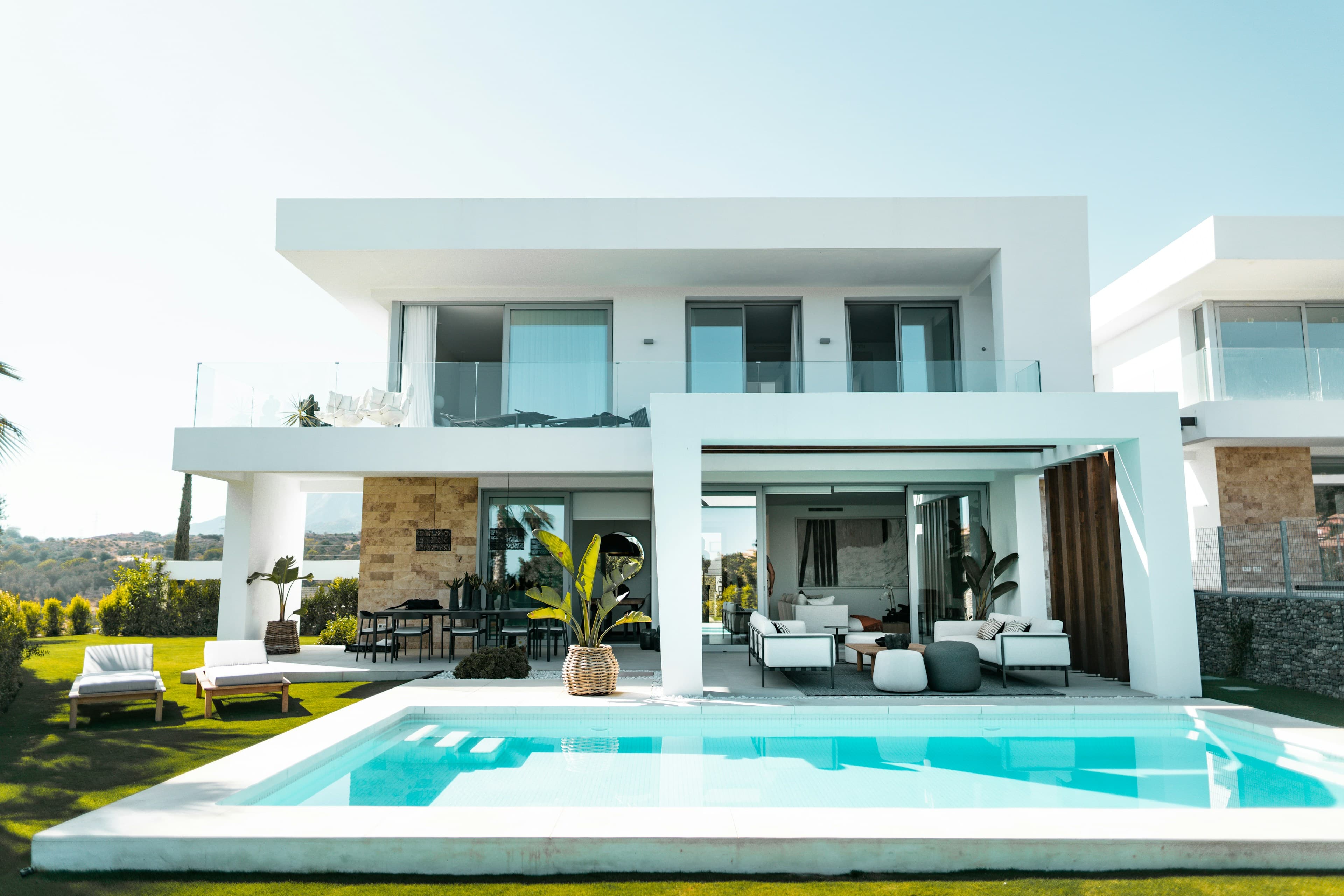 A contemporary white villa and pool