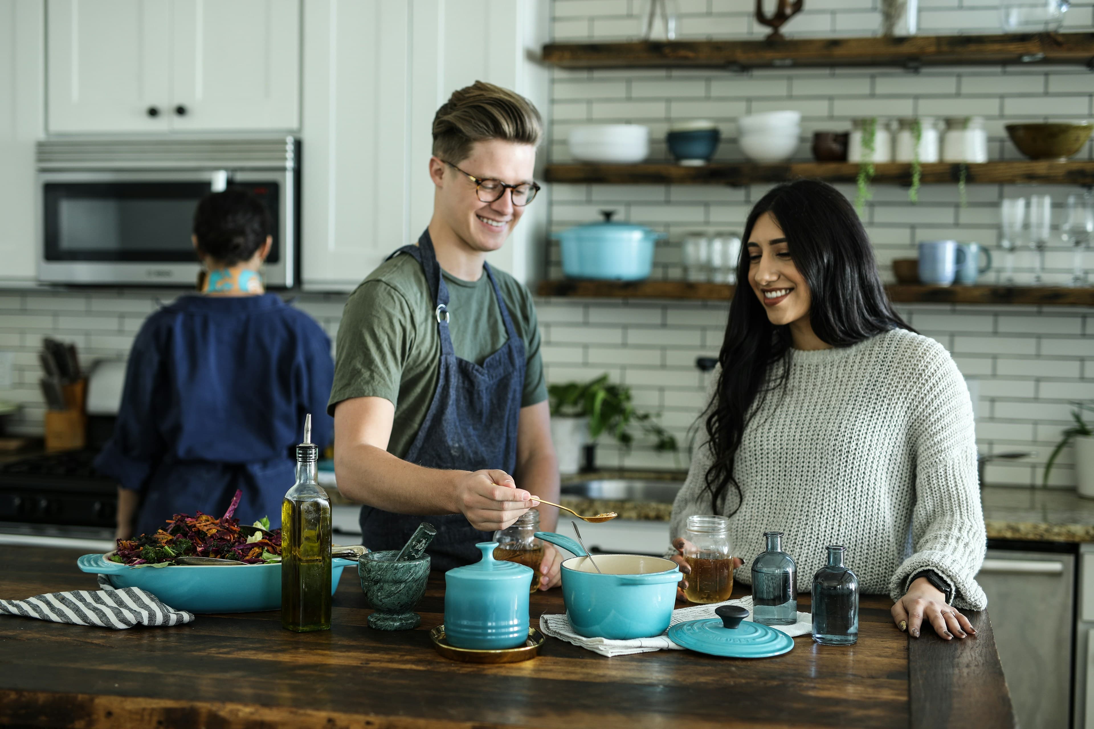 Two adults cooking together