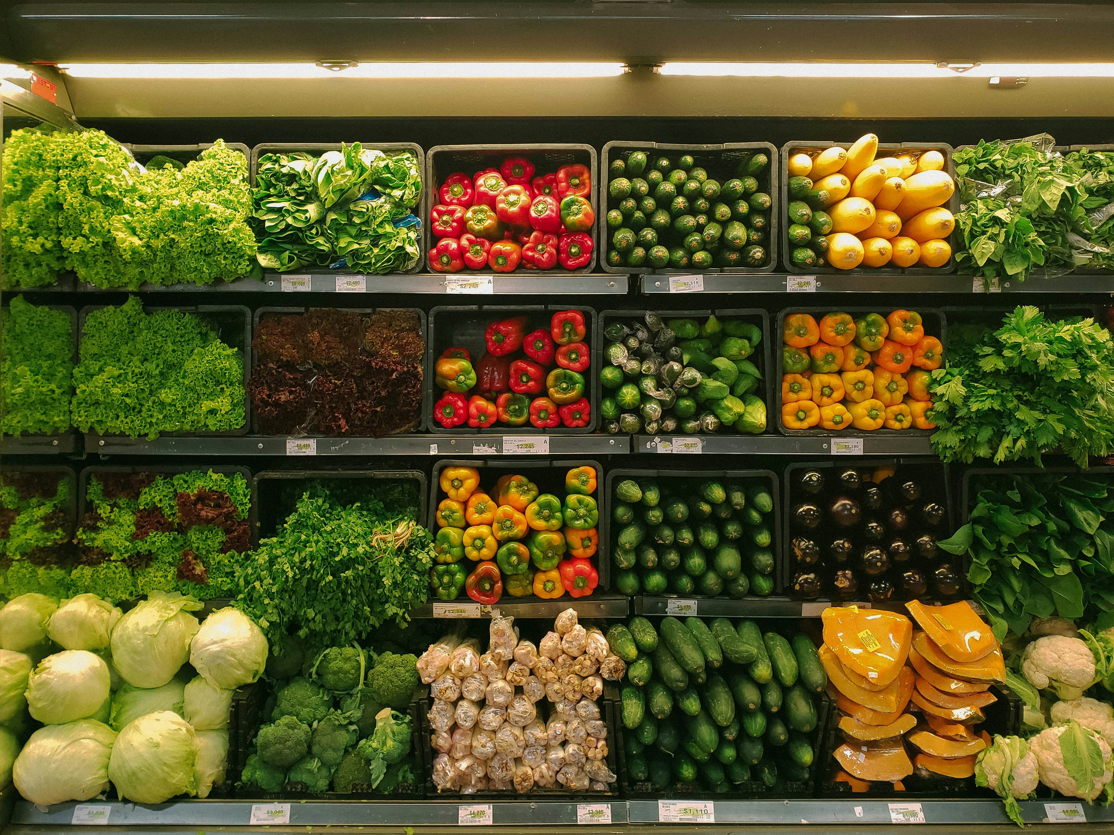 Fresh produce displayed in a grocery aisle