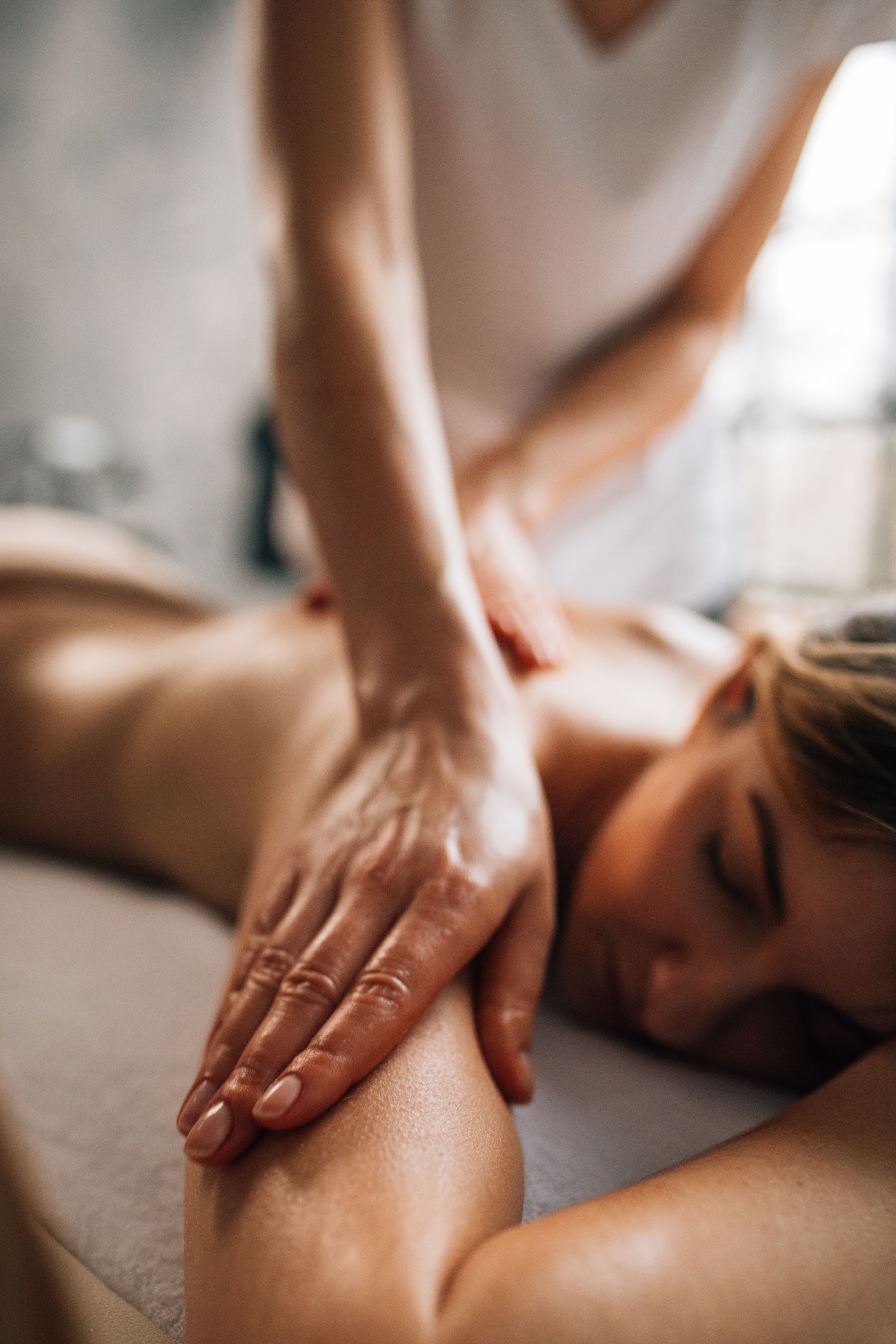 Relaxing massage in a softly lit spa