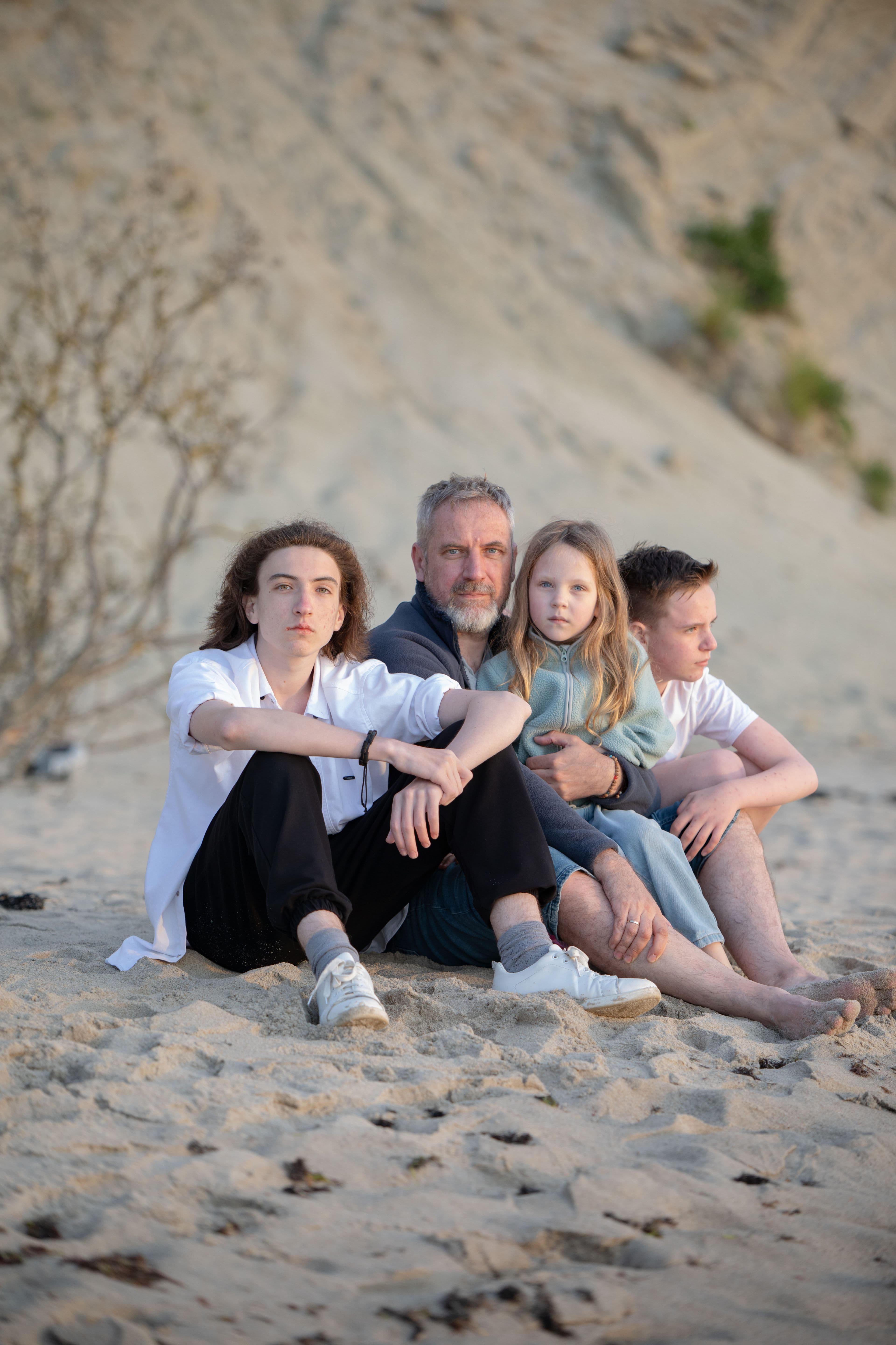 Family spending time together on a sandy beach