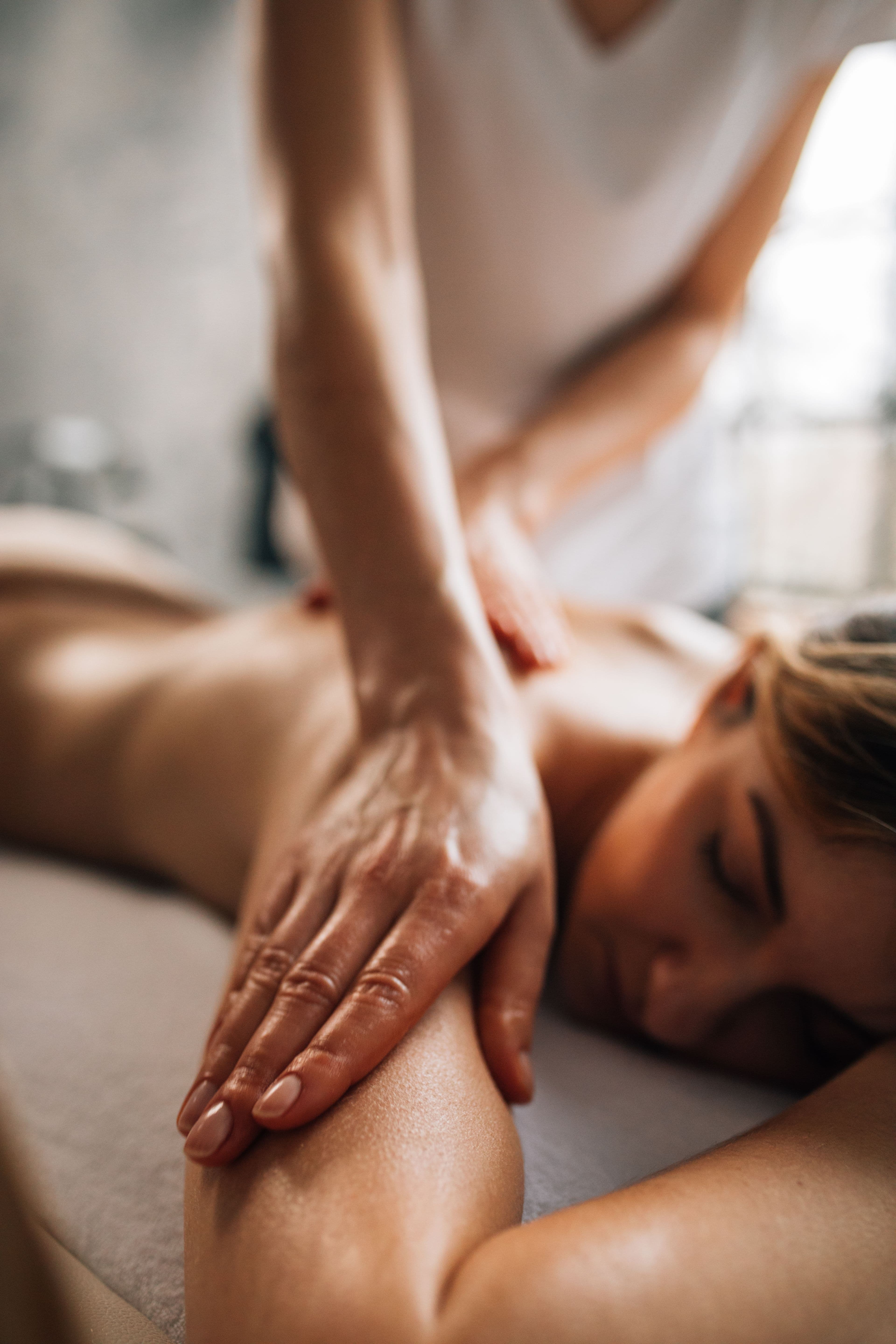 Massage in a softly lit spa